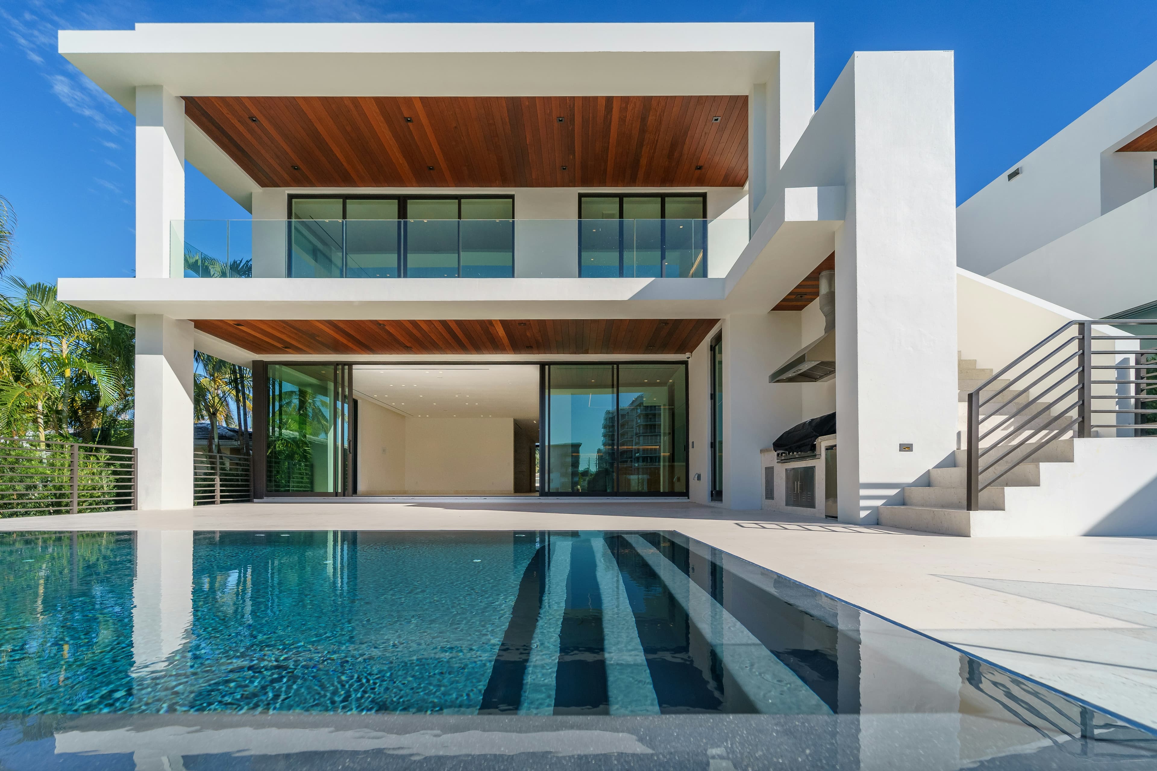 Glass-fronted contemporary residence at blue hour
